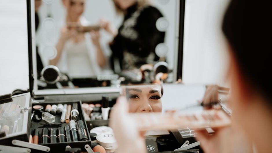 Bride getting ready with makeup artist
